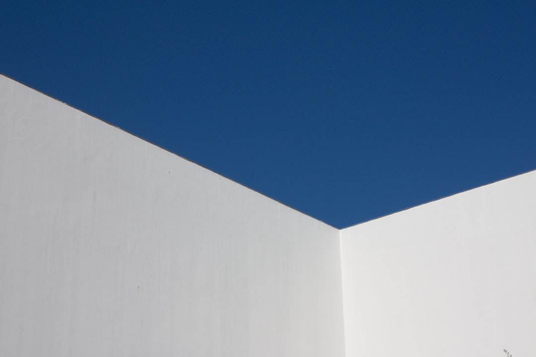 white concrete building under blue sky during daytime