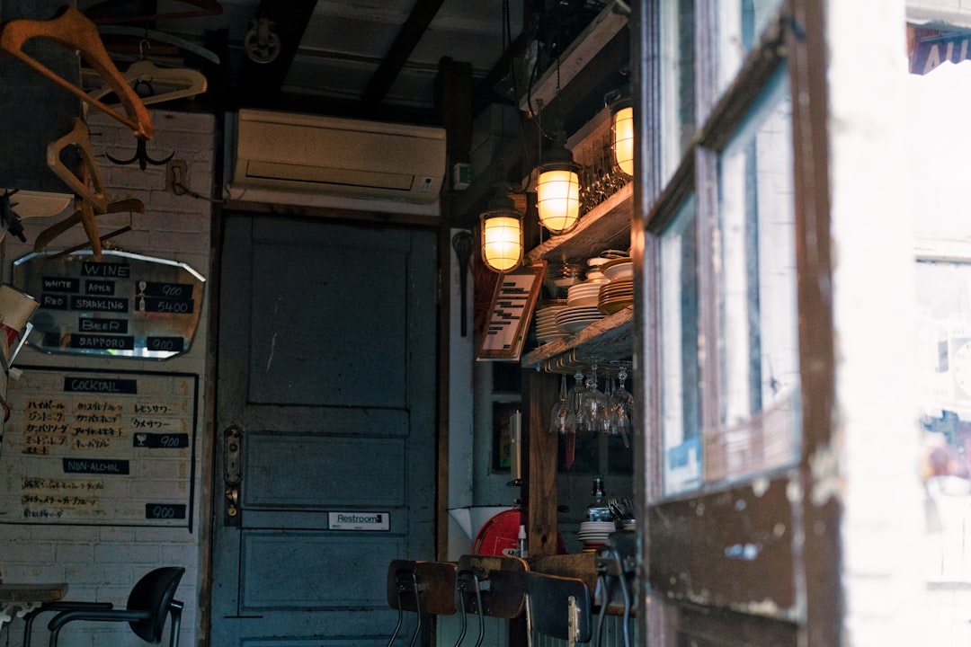 a room with a door and chairs