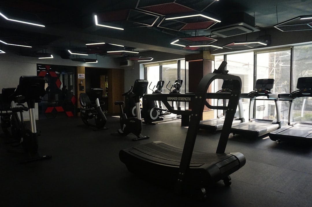 Modern gym with treadmills and exercise equipment.