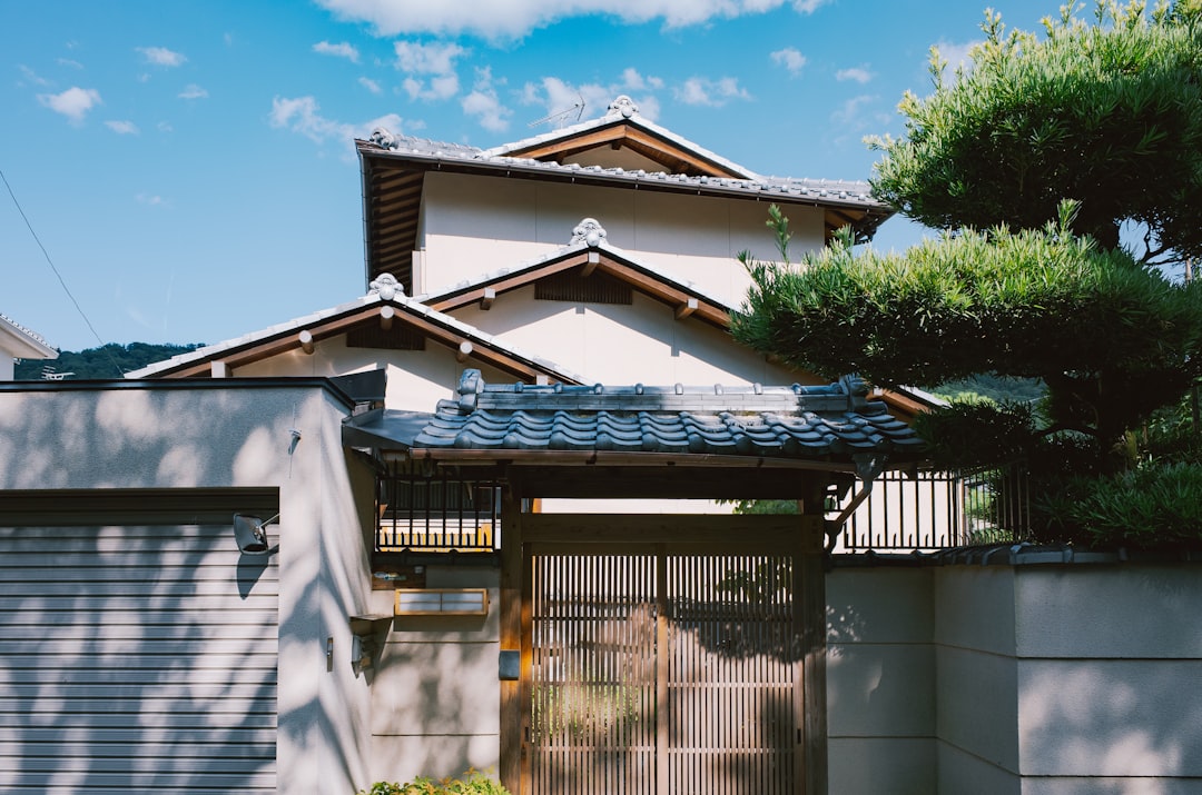 Traditional japanese house with tiled roof and gate