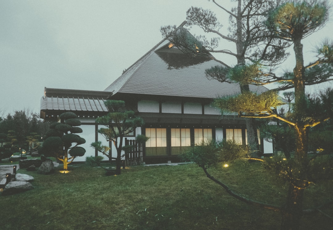 Traditional japanese house with manicured garden at dusk